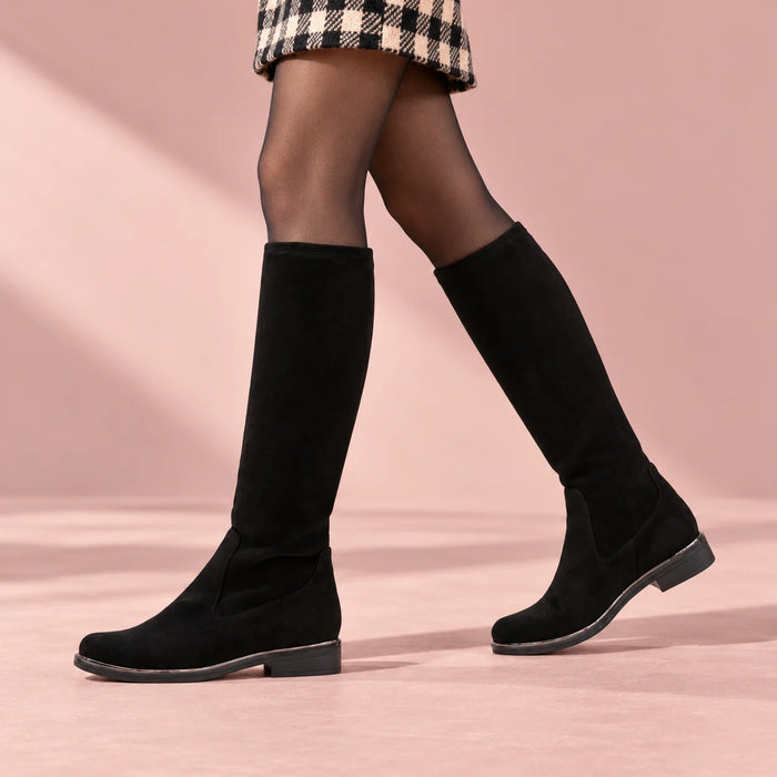 Caprice Black Stretch Vegan Knee-High Boots styled on a model