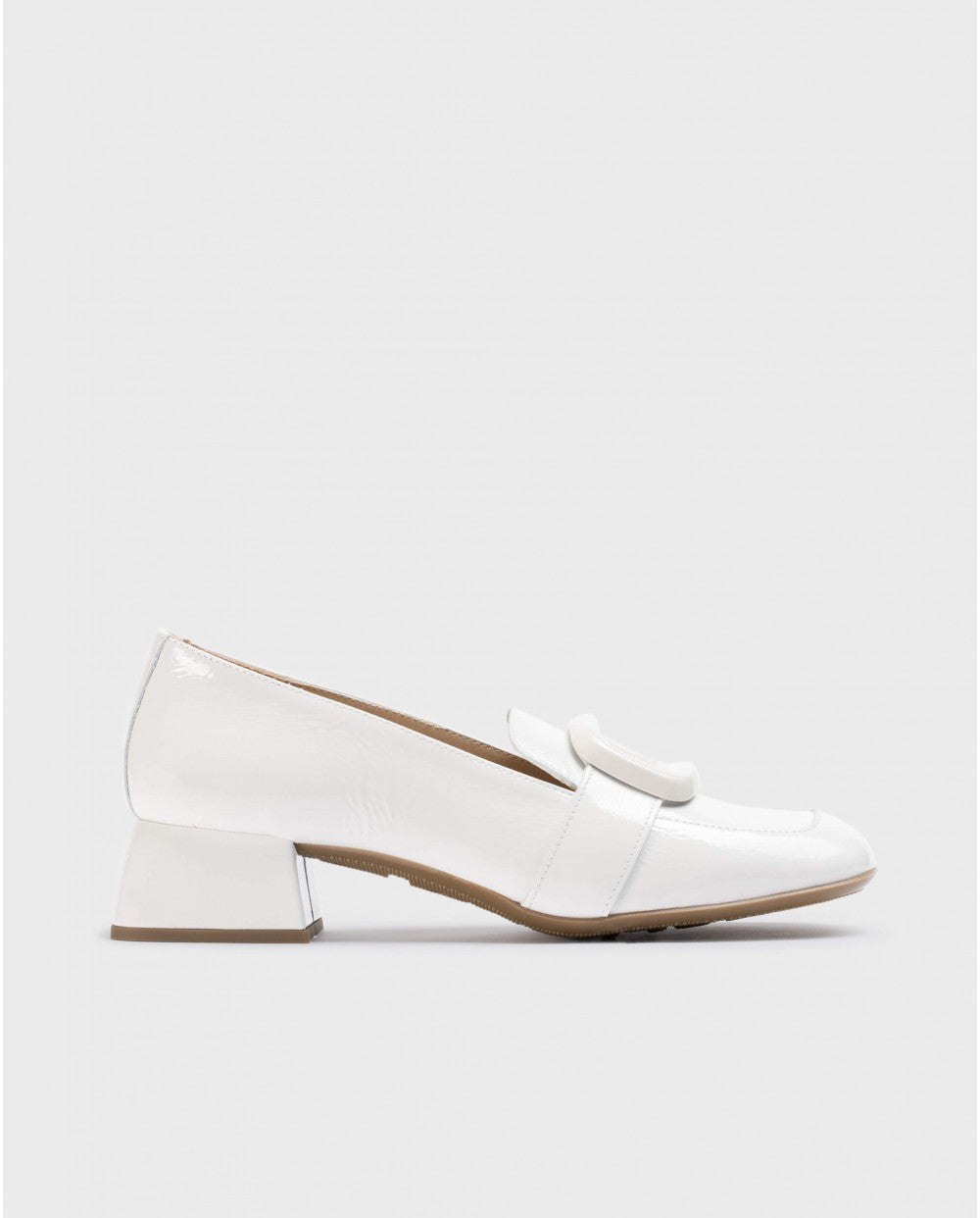     Sleek Wonders White Elein Patent Leather Moccasins with buckle detail.
