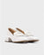     Sleek Wonders White Elein Patent Leather Moccasins with buckle detail.