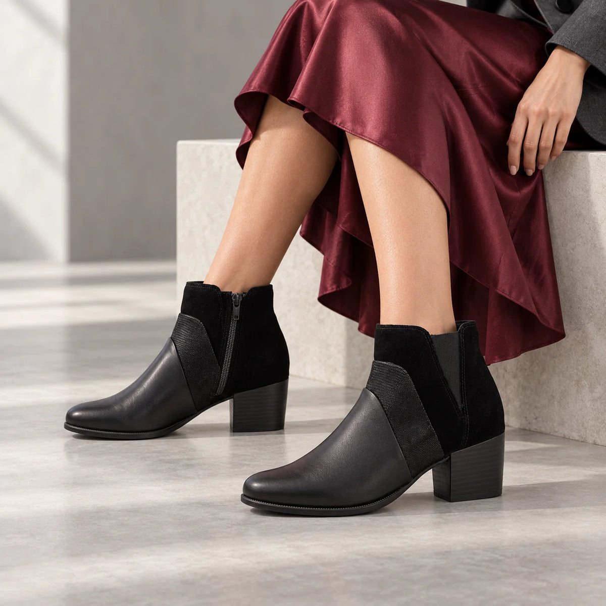 Dubarry Cindy black leather ankle boots styled with a burgundy satin skirt