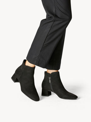 Woman wearing the block heel boot with pants