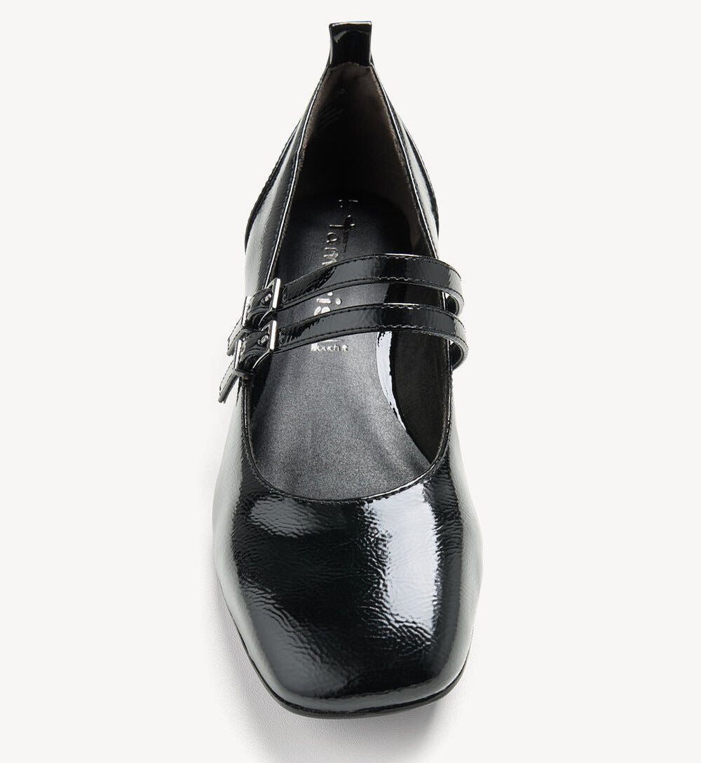 A black patent leather Mary Jane pump with double buckle straps, shown from a top-down view on a light gray background.