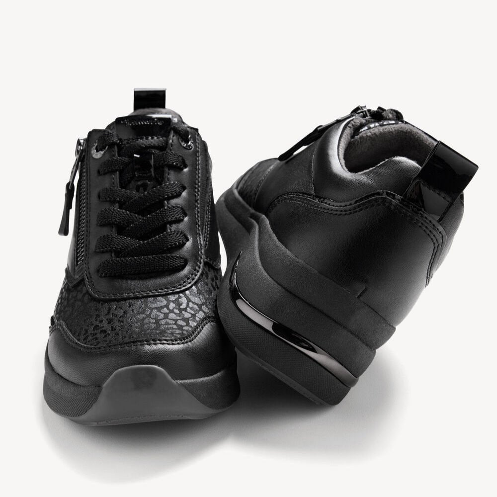 Pair of black sneakers on a white background