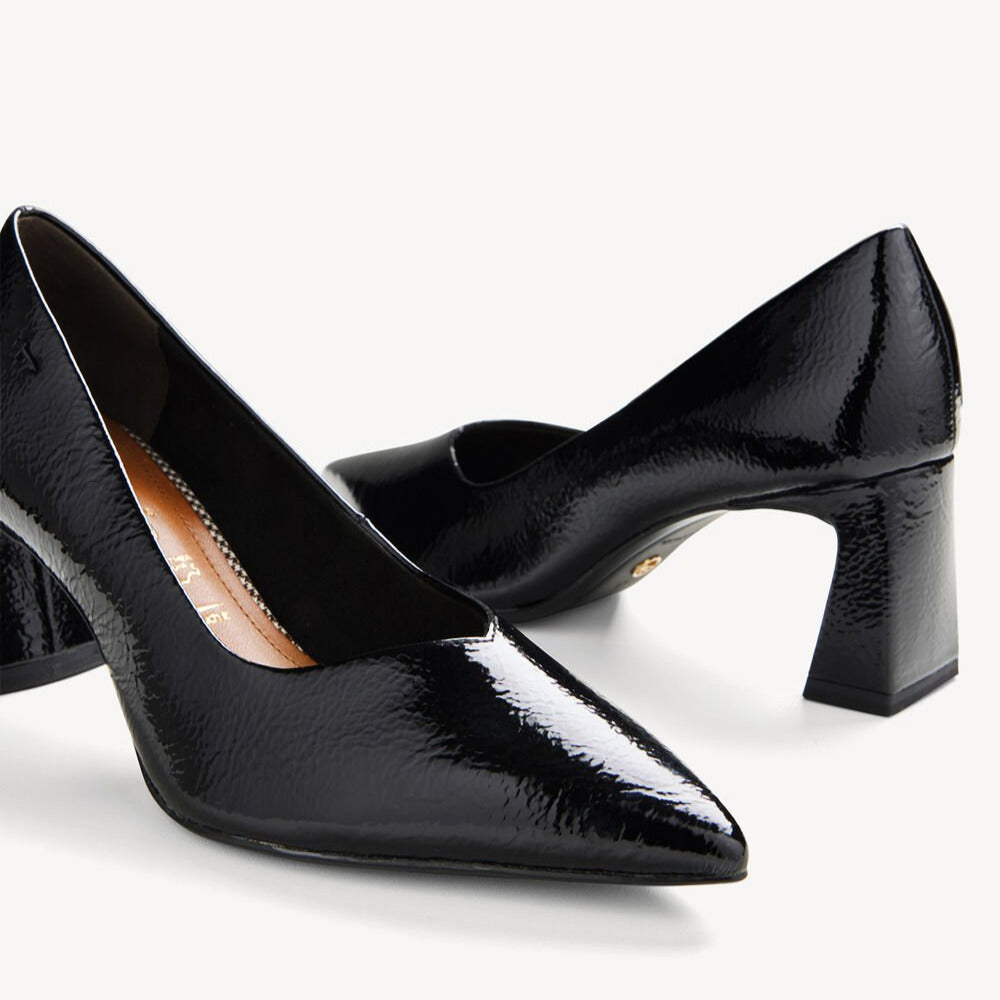 Pair of black high-heeled shoes on a white background