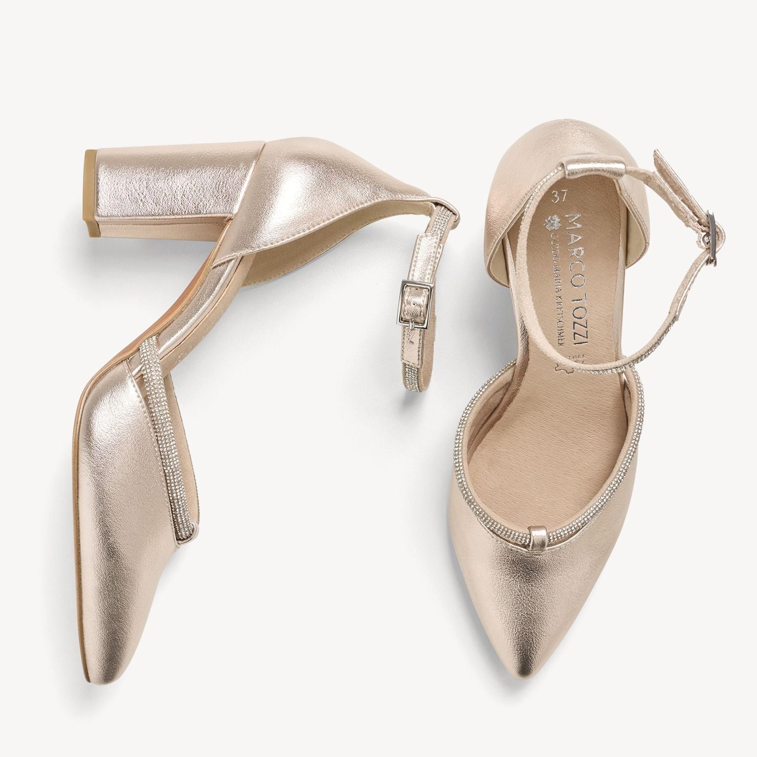 Pair of gold high-heeled shoes on a white background