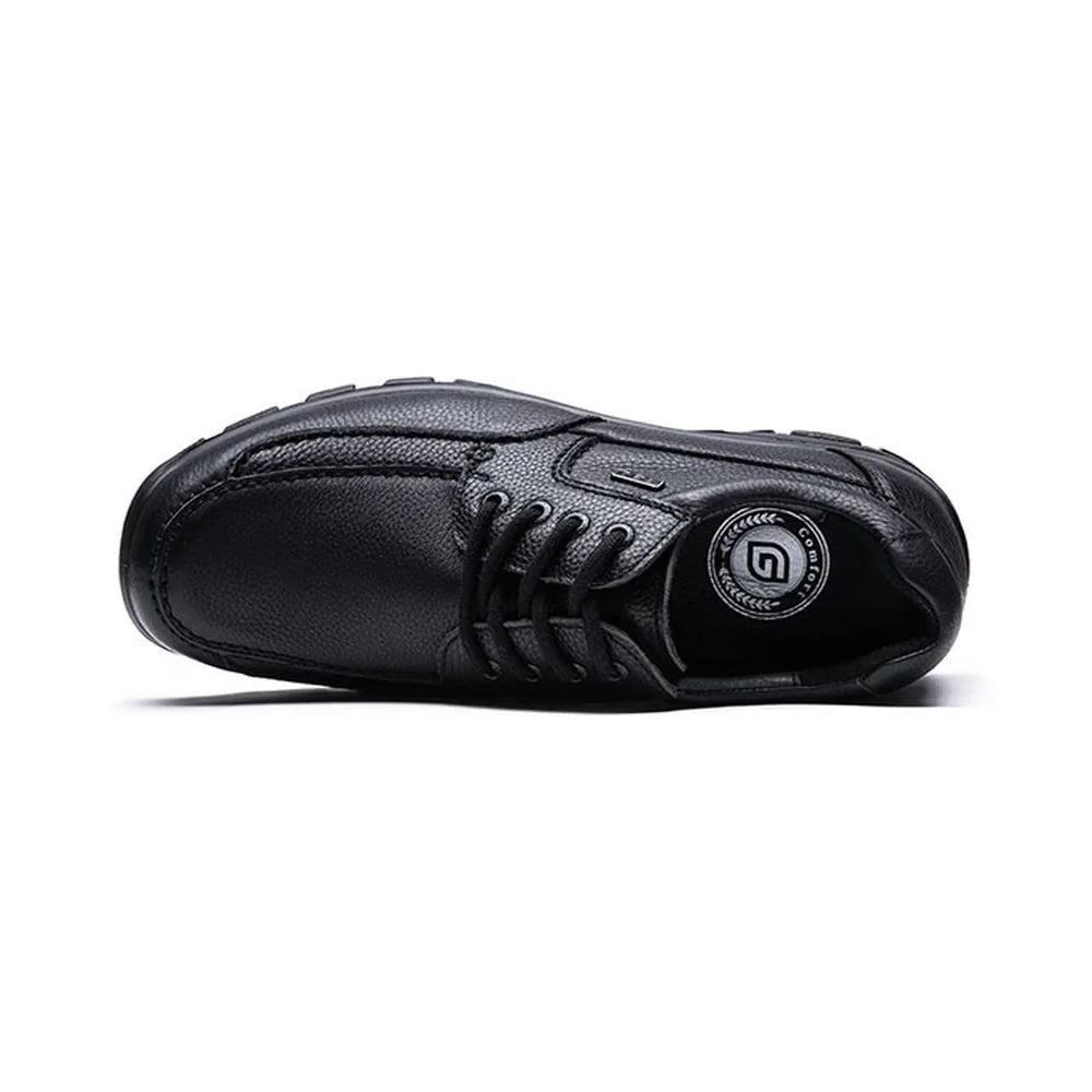 Top view of the G-Comfort A-7825 black shoe, showing the laces and stitched apron toe.