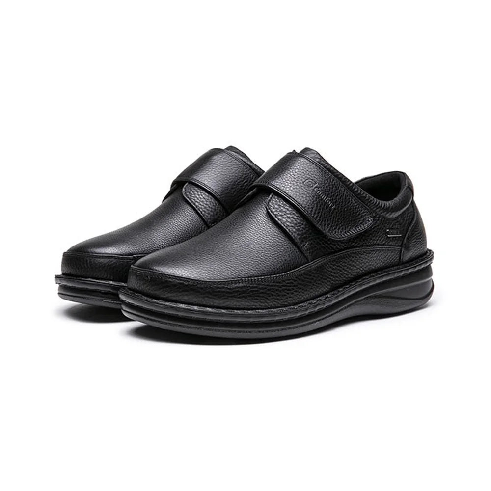 A pair of G-Comfort P-3708 men's black extra-wide leather strap shoes shown at a three-quarter angle.