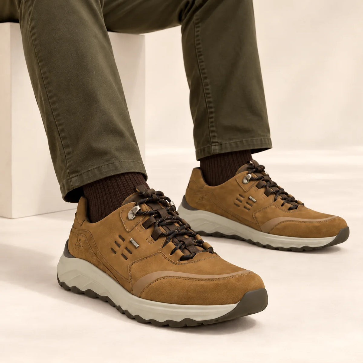 Male model wearing socks and Josef Seibel Davie 51 in Safran, square studio footwear view