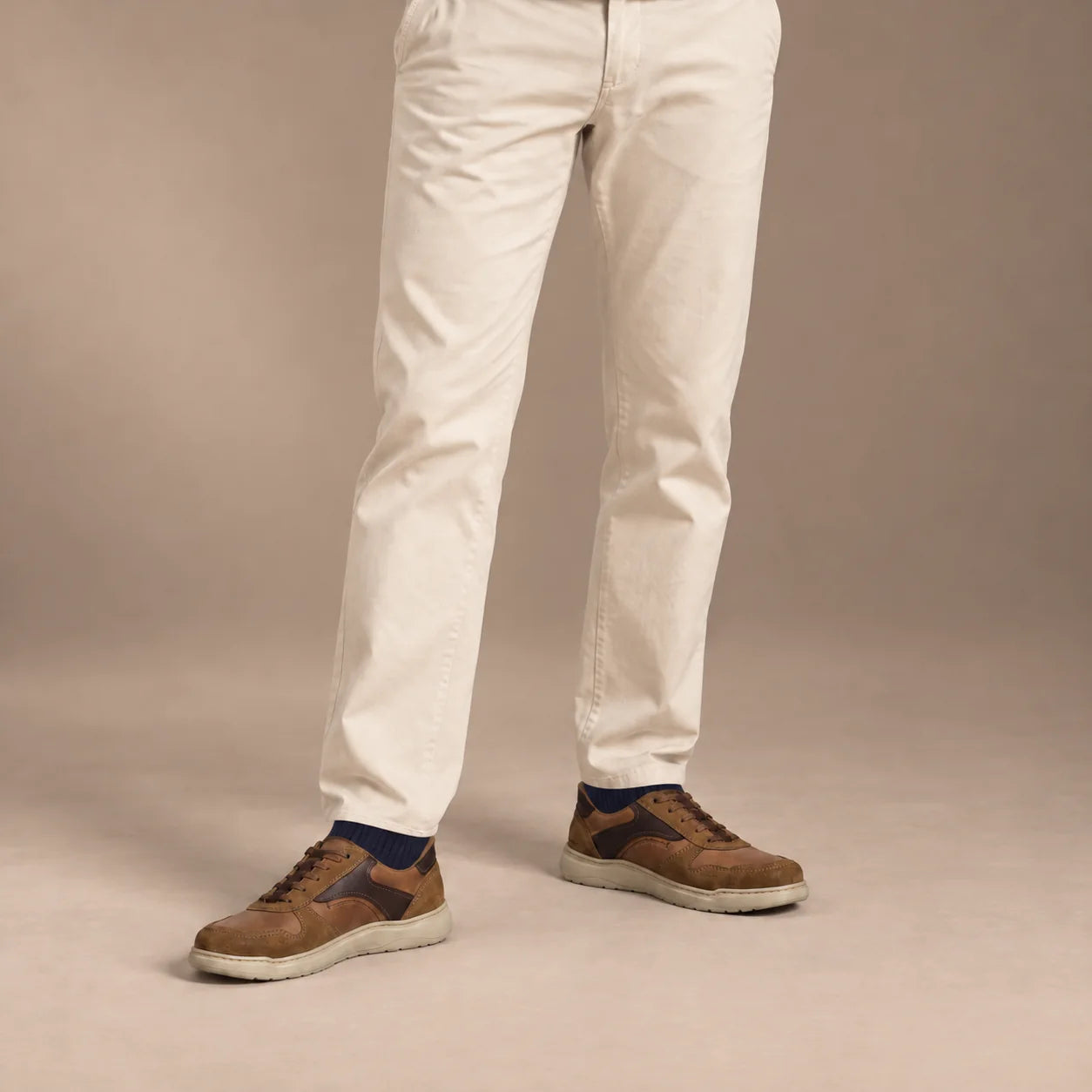 Male model wearing socks and Josef Seibel Baxter 01 in Chestnut Multi, square studio footwear view