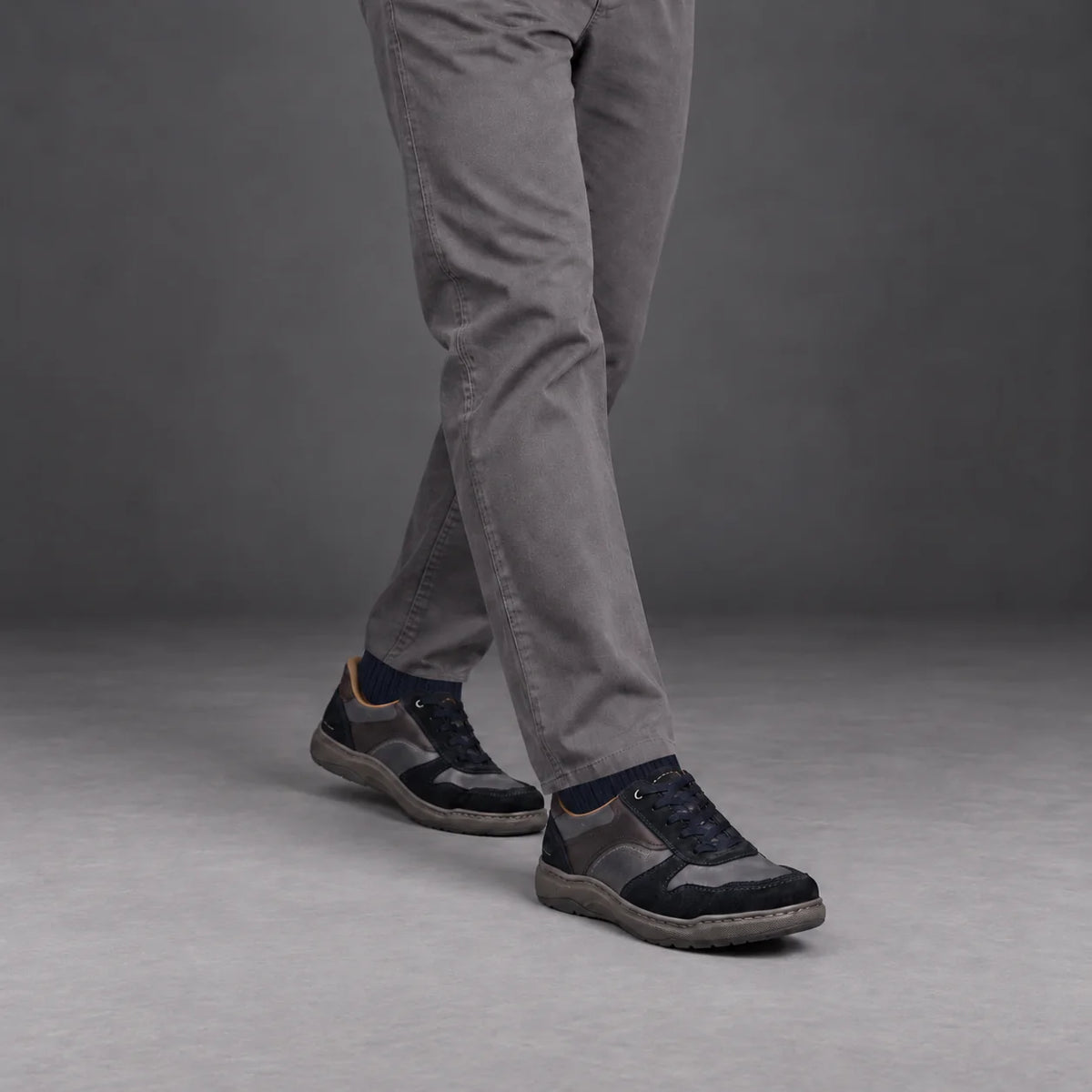 Male model wearing socks and Josef Seibel Baxter 01 in Navy Multi, square studio footwear view