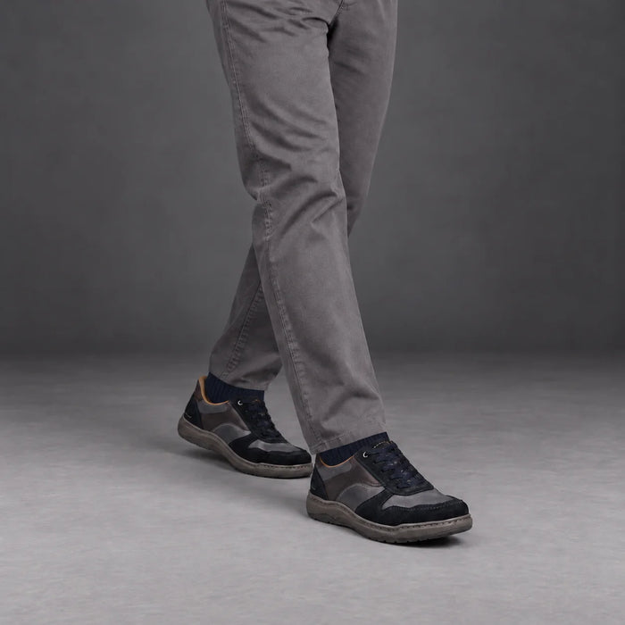 Male model wearing socks and Josef Seibel Baxter 01 in Navy Multi, square studio footwear view