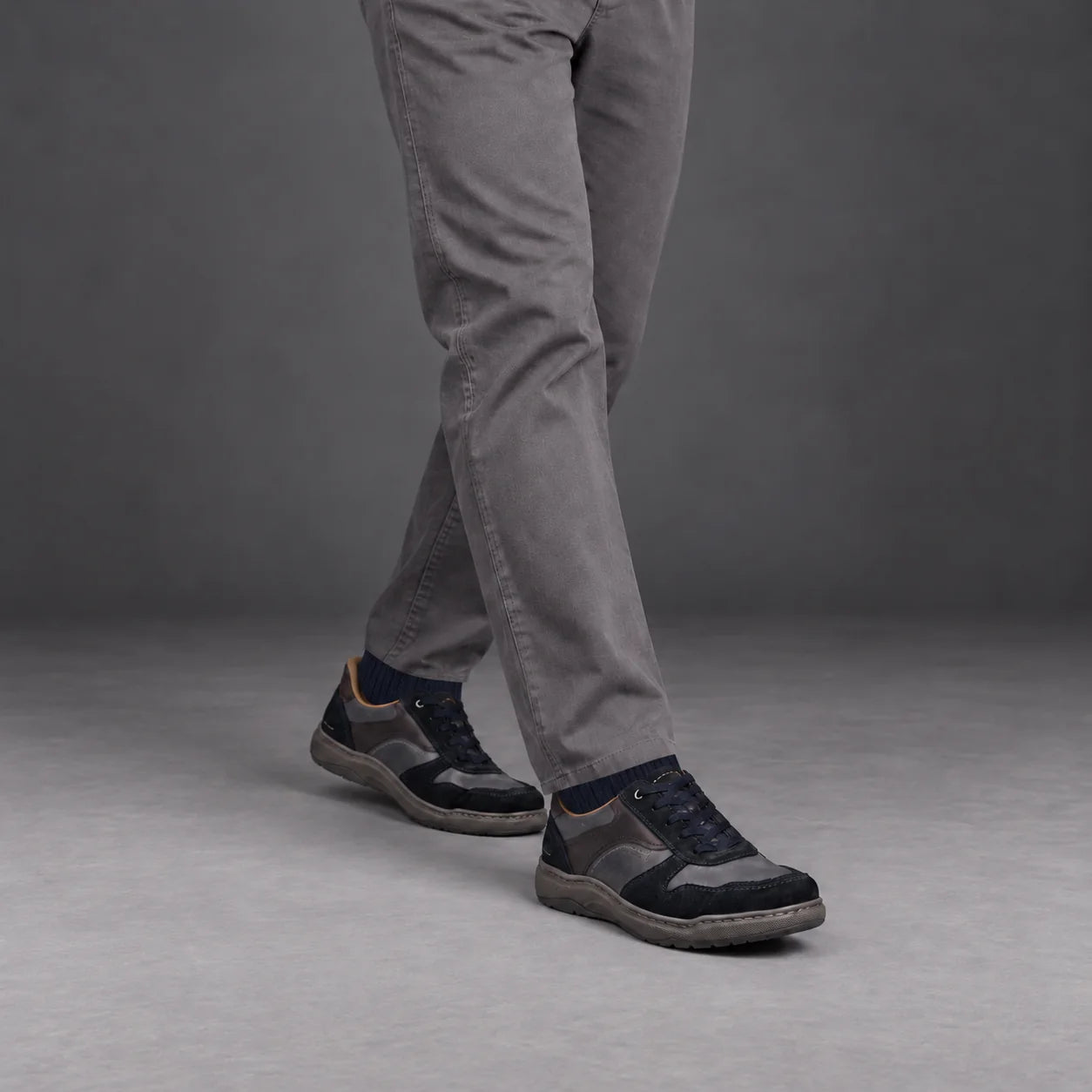 Male model wearing socks and Josef Seibel Baxter 01 in Navy Multi, square studio footwear view