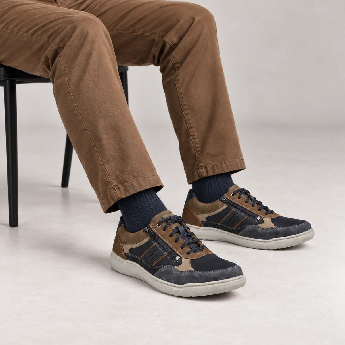 Male model wearing socks and Josef Seibel Baxter 06 in Ocean Multi, square studio footwear view