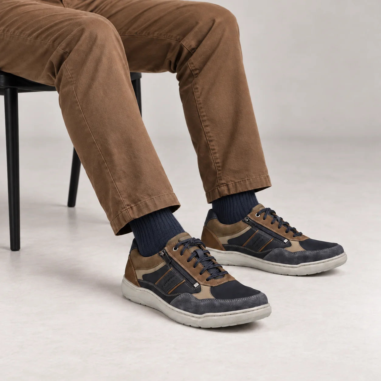 Male model wearing socks and Josef Seibel Baxter 06 in Ocean Multi, square studio footwear view