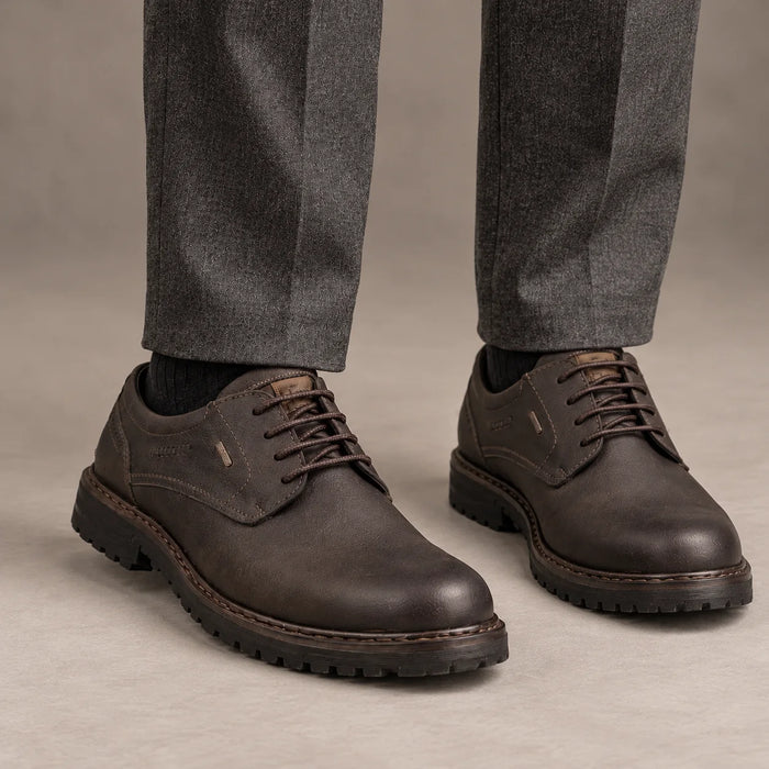 Male model wearing socks and Josef Seibel Erroll 50 in Moro Brown, square studio footwear view