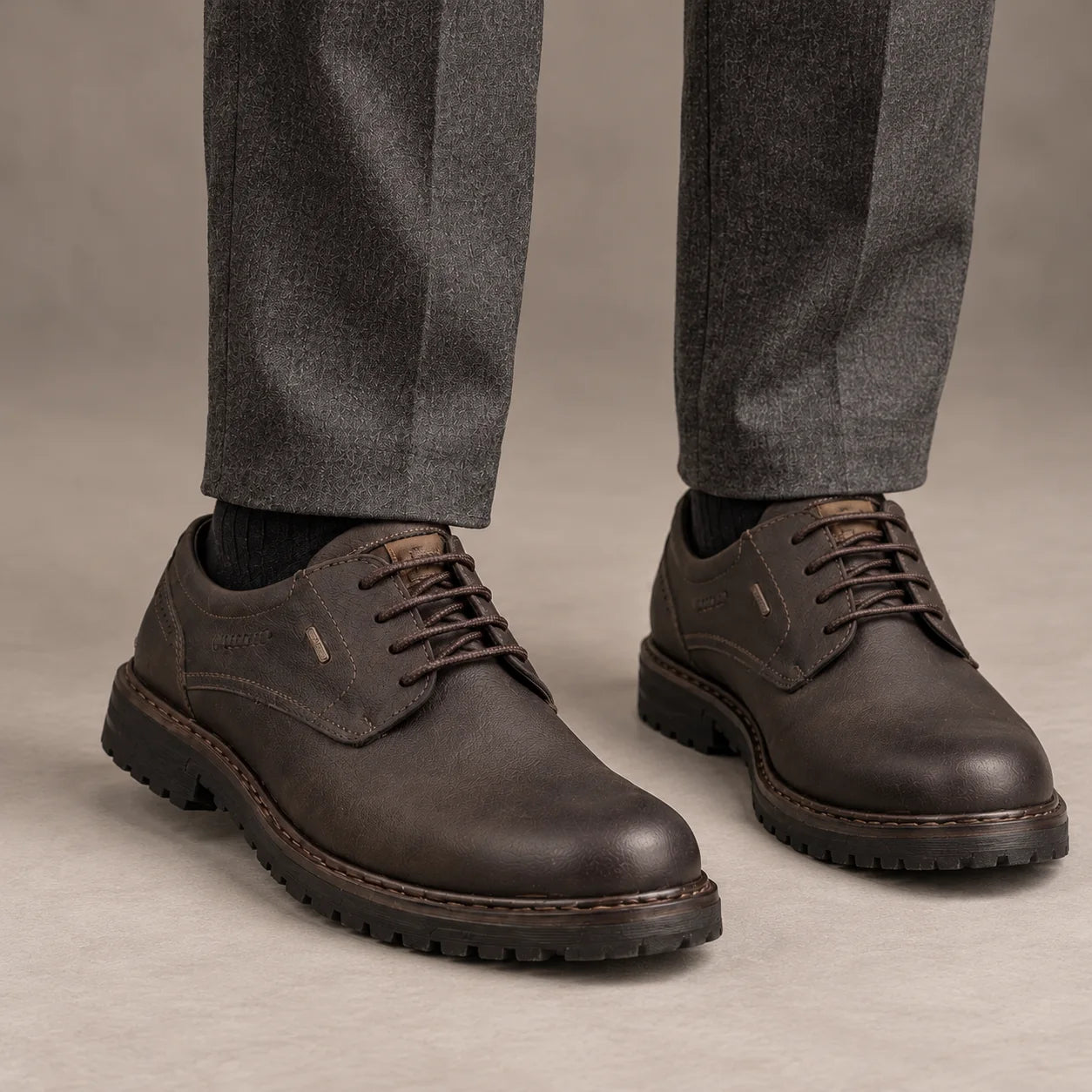 Male model wearing socks and Josef Seibel Erroll 50 in Moro Brown, square studio footwear view