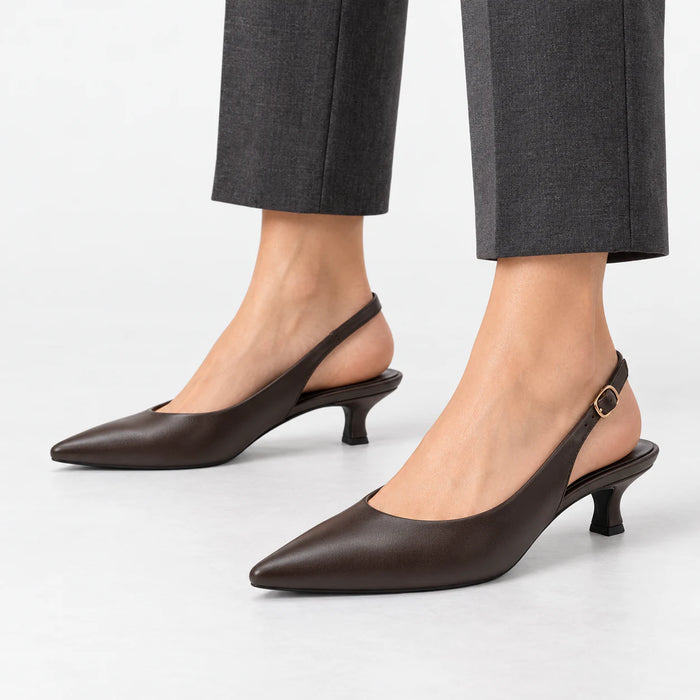 Marco Tozzi dark brown kitten heel slingback shoes worn with cropped charcoal trousers.