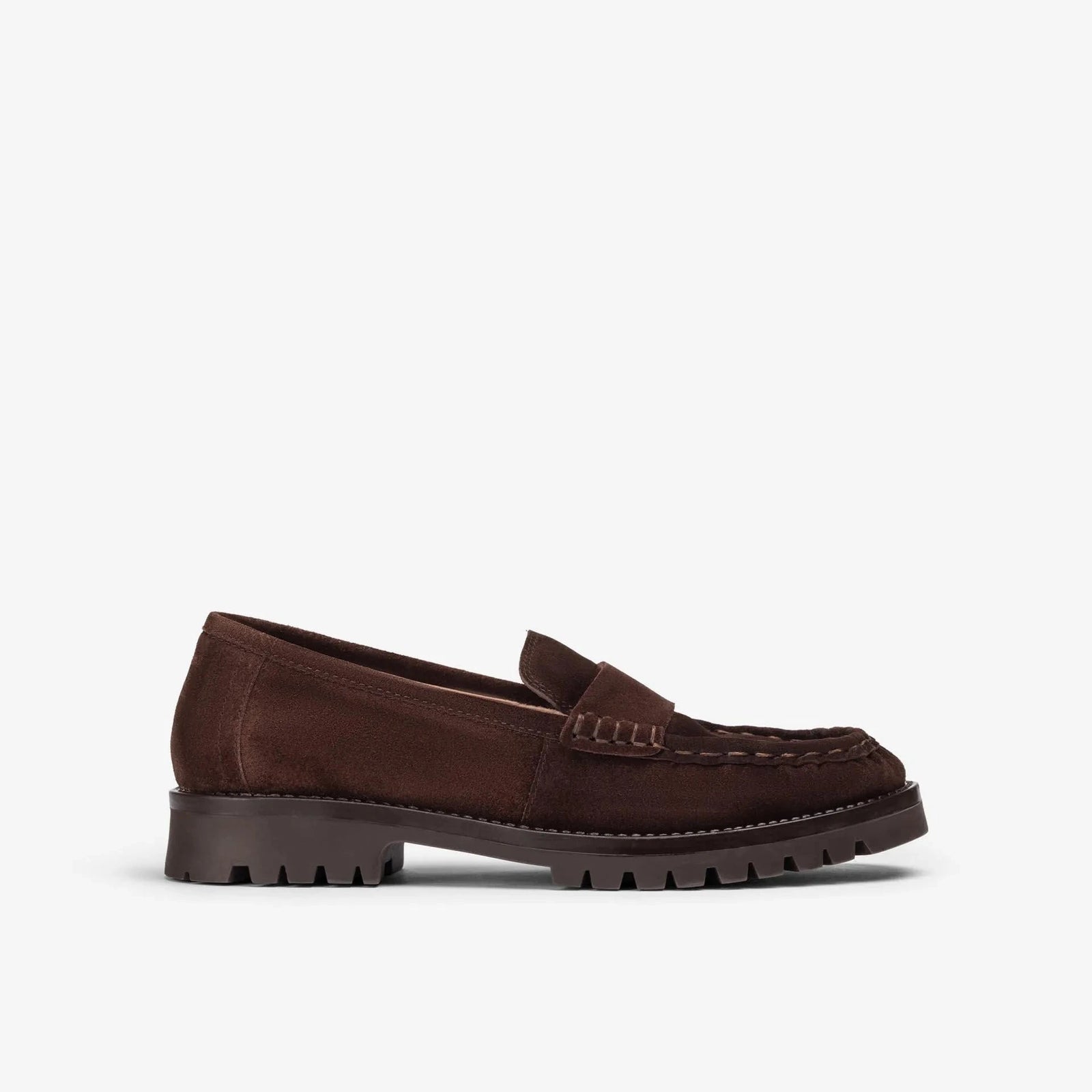 A black leather penny loafer slip-on shoe with a thick, textured off-white platform sole, shown in a side profile on a white background.