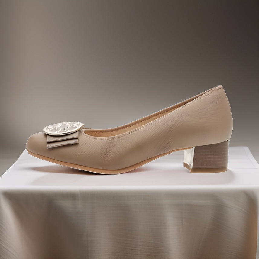     Front view of Ara Smooth Leather Pumps in Sand with bow ornament on the toe.