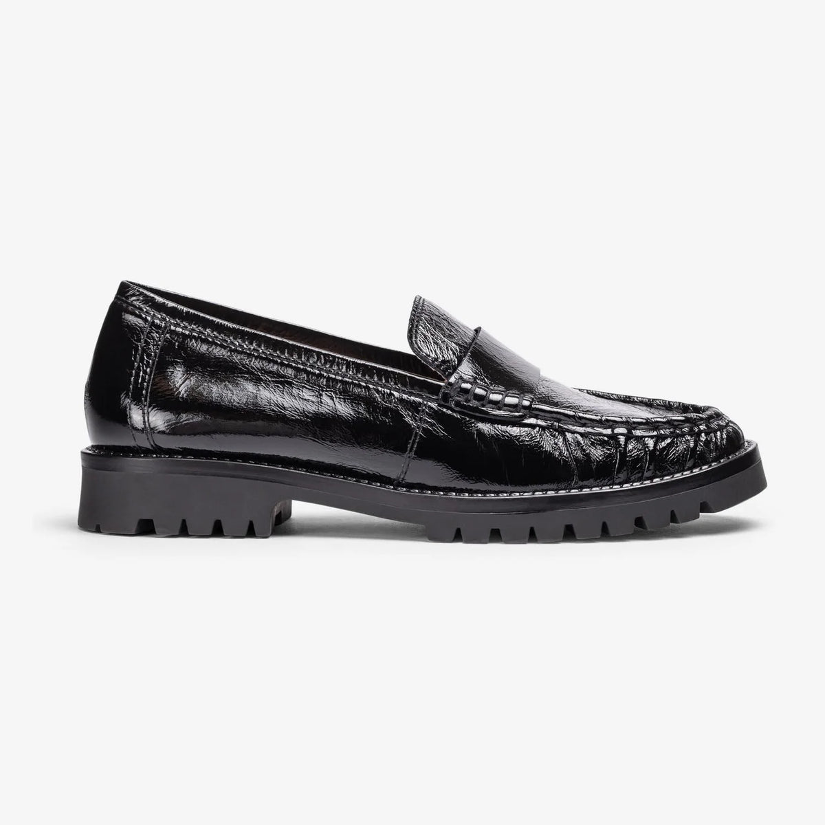 Side profile of the Unisa Fijo black patent loafer, showing the penny saddle and treaded sole.