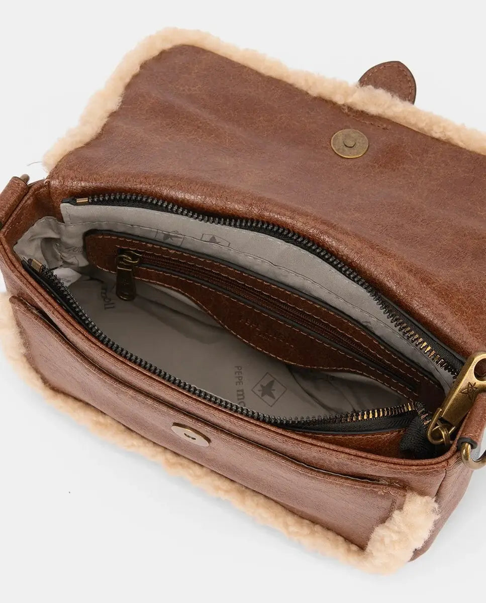 Brown leather wallet with shearling lining on a white background